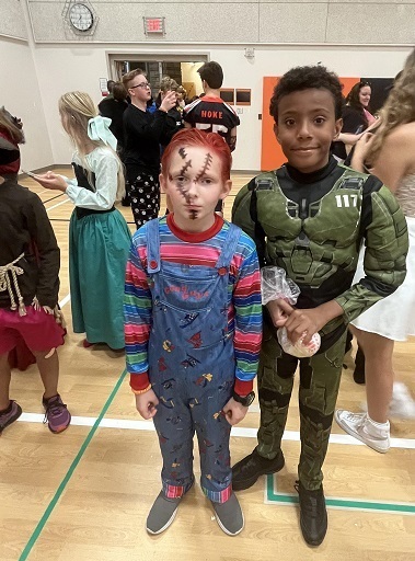 Boy dressed as Chucky and a GI Joe