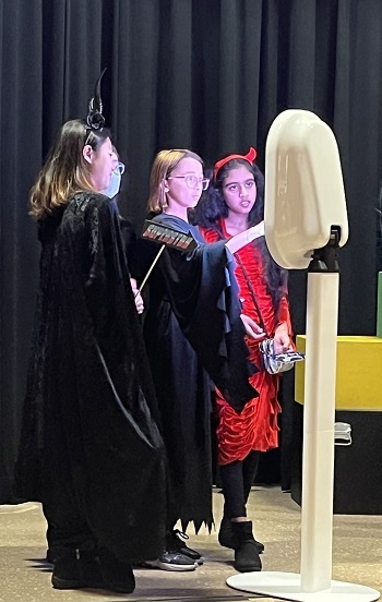 three girls taking a selfie at the Photobooth