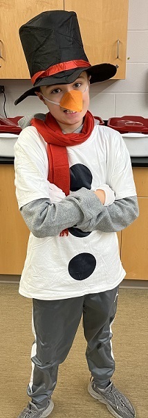 Snowman Day - student dressed like a snowman with a top hat, scarf and white shirt with large black buttons
