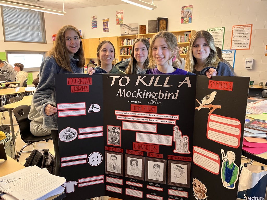 Students showing off their "To Kill a Mockingbird" Project
